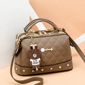 Brown quilted boston bag with litchi texture and a bear character charm pendant - Khaki