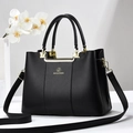 Elegant black lychee leather handbag for women with gold hardware and three compartments - Black