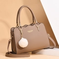 Khaki faux leather handbag with wave design, gold metal handles and soft pompom charm - Khaki