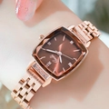 Women's rose gold watch with brown sunray dial and faceted crystal, worn on wrist - Rose Gold Case Coffee Dial