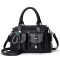 Elegant black soft leather handbag featuring dual front pockets and a chic star charm - Black