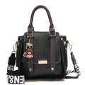 Retro black leather handbag with brown handles and a wide lettered shoulder strap - Black