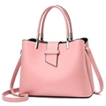 Pink minimalist crossbody handbag with dual handles and metal buckle on white background - Pink