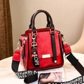 Red retro leather handbag with contrast brown handles and a stylish wide fabric strap - Red