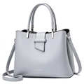 Minimalist light grey crossbody bag with silver branding and adjustable strap - Gray
