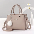 Elegant mauve leather handbag with Danbaoly logo and white plush charm accessory - Khaki