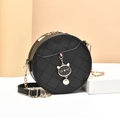 Chic black round crossbody bag with quilted stitching, cat charm, and chain strap - Black