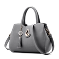 Grey pebbled leather handbag with gold twist lock and elegant tassel decoration - Dark Gray