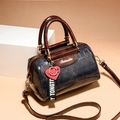 Blue crocodile pattern Boston bag with brown handles and a red heart charm - Denim Blue