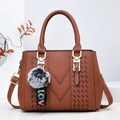 Brown litchi grain faux leather handbag with V-stitching and two-tone plush pom-pom - Earthy Yellow