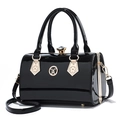 Fashionable black patent leather cylinder handbag with gold hardware and shoulder strap - Black