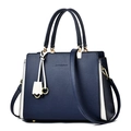 Bolso de mano en cuero azul marino y blanco con elegantes herrajes dorados - Azul oscuro