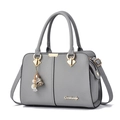 Elegant grey lychee leather handbag with adjustable shoulder strap and floral charm pendant - Light Gray