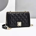 Classic black quilted leather chain bag for women with gold clover buckle in studio setting - Black