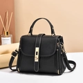 Chic black litchi leather handbag with white contrast stitching and gold metal hardware - Black