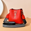 Elegant red bucket bag with golden cat ear ring tassel and woven strap - Red