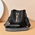 Black leather bucket bag with golden cat ear ring, tassel charm and wide zigzag strap - Black