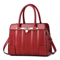 Red textured leather handbag for women featuring gold hardware and a top handle strap - Red
