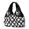 Women's handbag featuring black and white geometric ring print and soft leather trim - Black / Circle Print