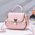 Pink quilted PU leather crossbody bag with iconic Mickey mouse silhouette buckle and star pendant - Pink