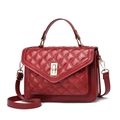 Deep red quilted crossbody bag with gold-tone twist lock and adjustable shoulder strap - Burgundy