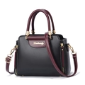 Women's black and burgundy color-block handbag with gold hardware and shoulder strap - Black