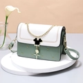 Pastel green quilted heart crossbody bag with white flap and black mouse pendant - Green & Beige