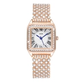 Macro detail of luxury square rose gold watch with sparkling rhinestones and blue hands - Rose Gold/White Dial