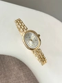Orologio vintage dorato da donna con quadrante ovale e indici a numeri romani - Cassa Dorata Quadrante Bianco