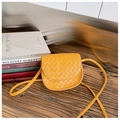 Detail of a ginger yellow woven mini crossbody bag with a quilted PU leather texture - Yellow