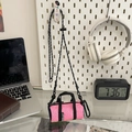 Pink mini crossbody sports bag for phone and keys with adjustable strap on pegboard - Pink / Small