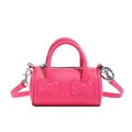 Pink cylindrical bucket bag for girls with embossed bow detail and adjustable shoulder strap - Pink