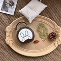 Detail of round leather rabbit shoulder bag with a gold chain on a vintage tray - Dark Brown