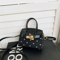 Miniature black and white polka dot children's handbag with golden lock and shoulder strap - Black