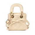 Mini cream quilted handbag for girls with decorative bow and adjustable shoulder strap - White