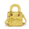 Bright yellow quilted mini handbag with decorative bow and adjustable strap - Yellow