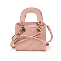 Pink quilted mini handbag for girls featuring a cute bow and detachable shoulder strap - Pink