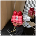 Close-up of kids red plaid shoulder bag featuring a 3D bow and cute bear embroidery - Red