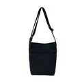 Minimalist black washed canvas crossbody bag with adjustable strap and front pocket - Black