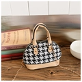 Detail view of small houndstooth shell bag with beige leather trim and gold chain strap - Khaki