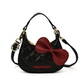 Black quilted cat-themed crossbody bag with large red bow and letter embroidery - Black