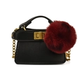 Mini black leather shoulder bag with a gold clasp and a large burgundy fur ball detail - Black With Hairball