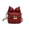 Kids red quilted box bag with large bow and pearl zipper pull on white background - Red