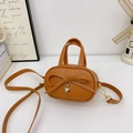 Caramel brown kids mini crossbody bag with sweet bow and heart charm detail - Brown