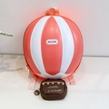 Detail view of the 3D hot air balloon hardshell backpack with a small canvas charm bag - Orange