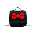 Mini girls shoulder bag in black lychee leather with a large red bow detail and chain - Black