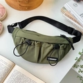 Detail of army green nylon kids chest bag featuring drawstring pockets and adjustable strap - Green