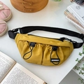Detail of bright yellow kids chest bag with elastic drawstrings and adjustable strap - Yellow