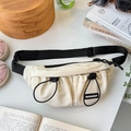 Detailed shot of beige nylon kids chest bag with black adjustable straps and bungee cords - White