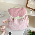 Dettaglio dello zaino anguria rosa con ricamo di semi e tasca con coulisse regolabile - Rosa